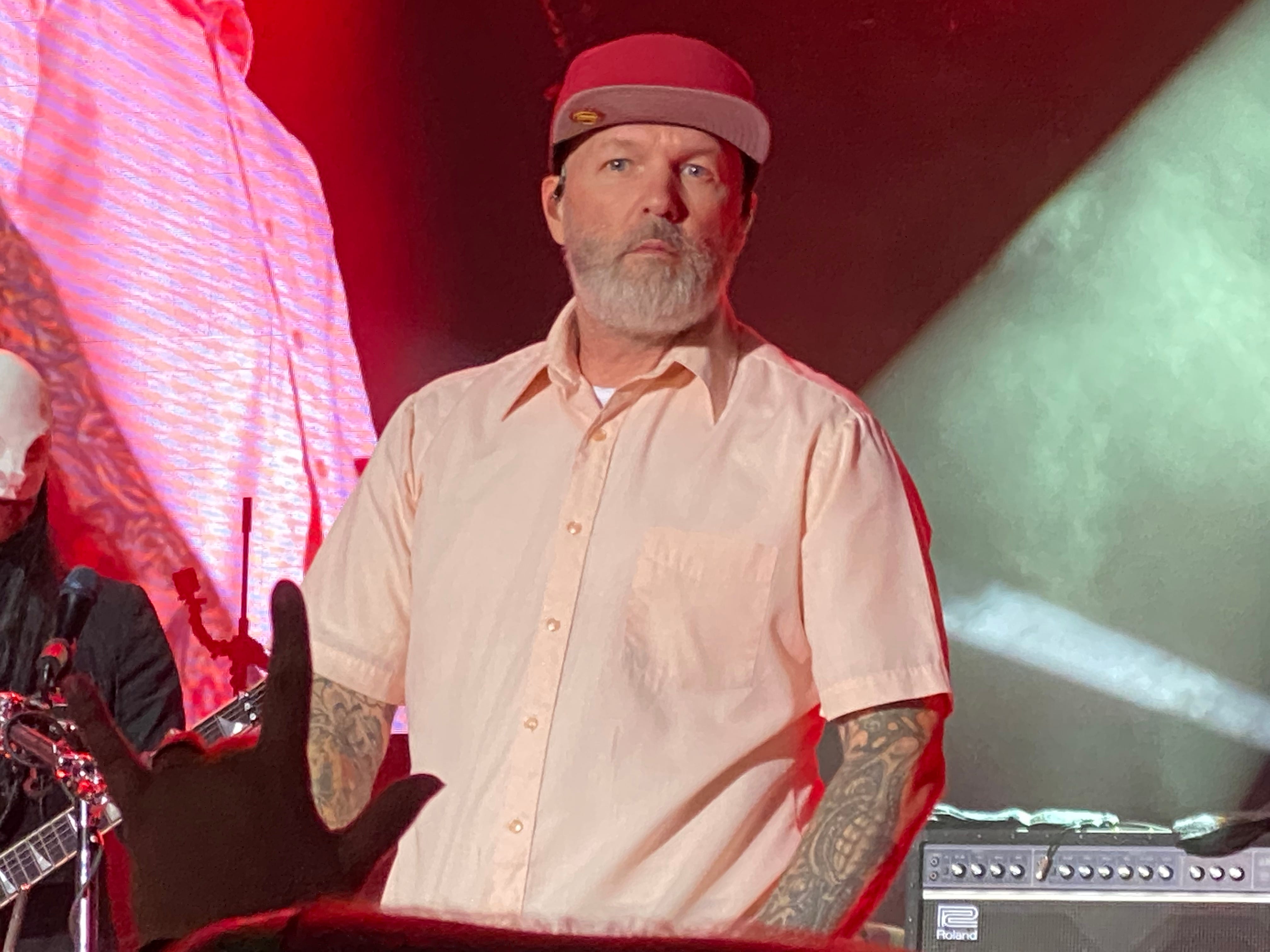 A picture of an elderly gentleman in a red hat. The man's name is Fred Durst